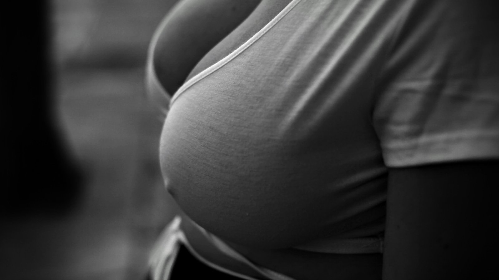 SFW macro of shirt curve; no face