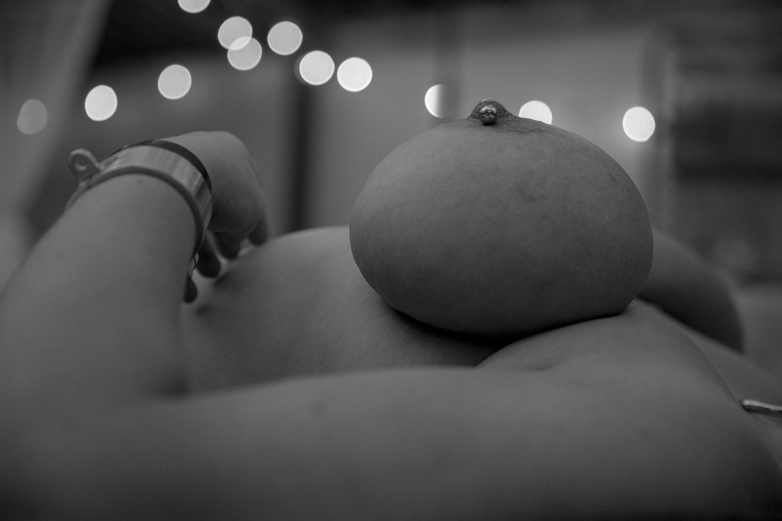 NSFW macro; rubber-band compression on breast; explicit
