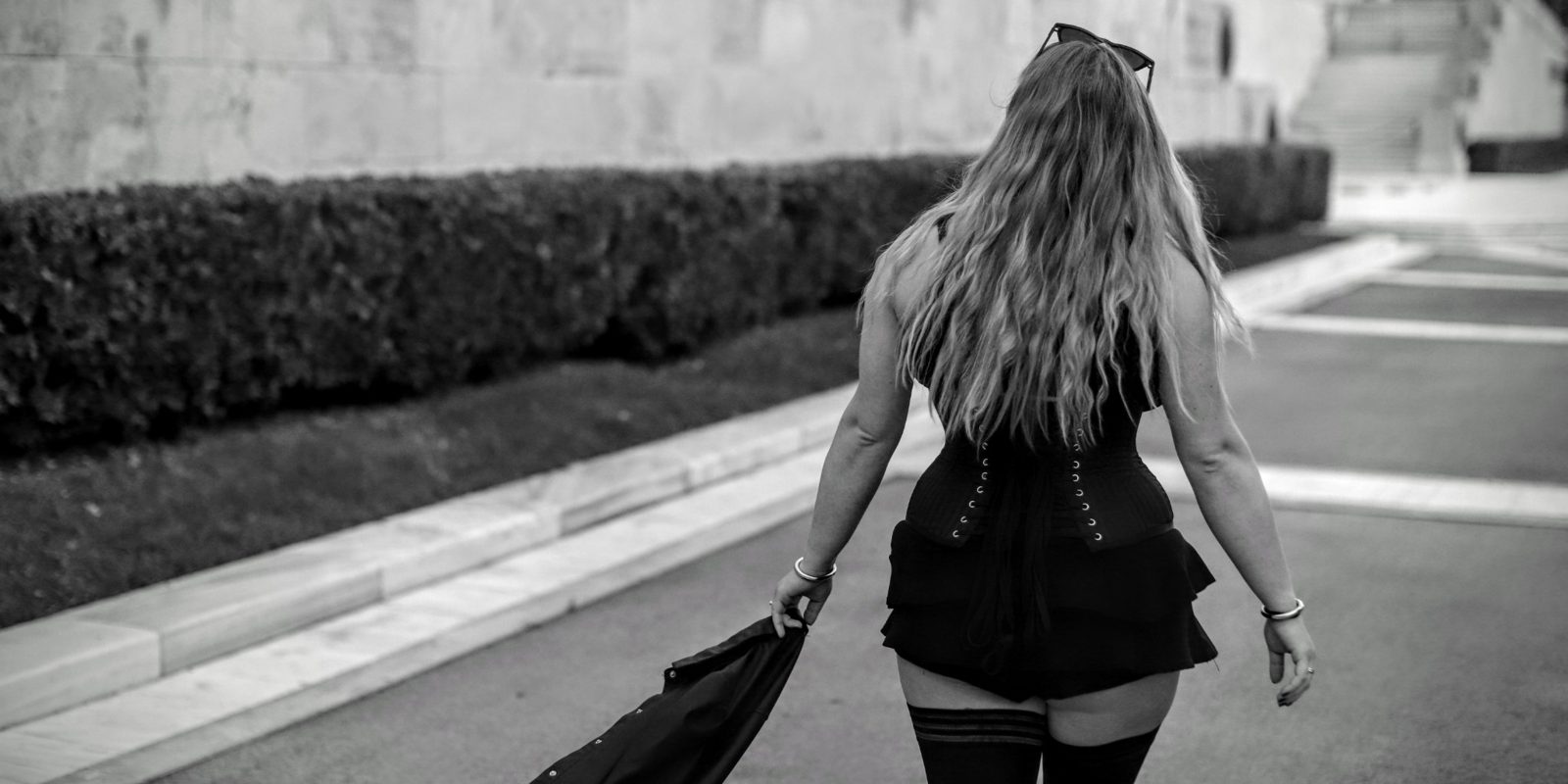 SFW rear view, corset outdoors, no face